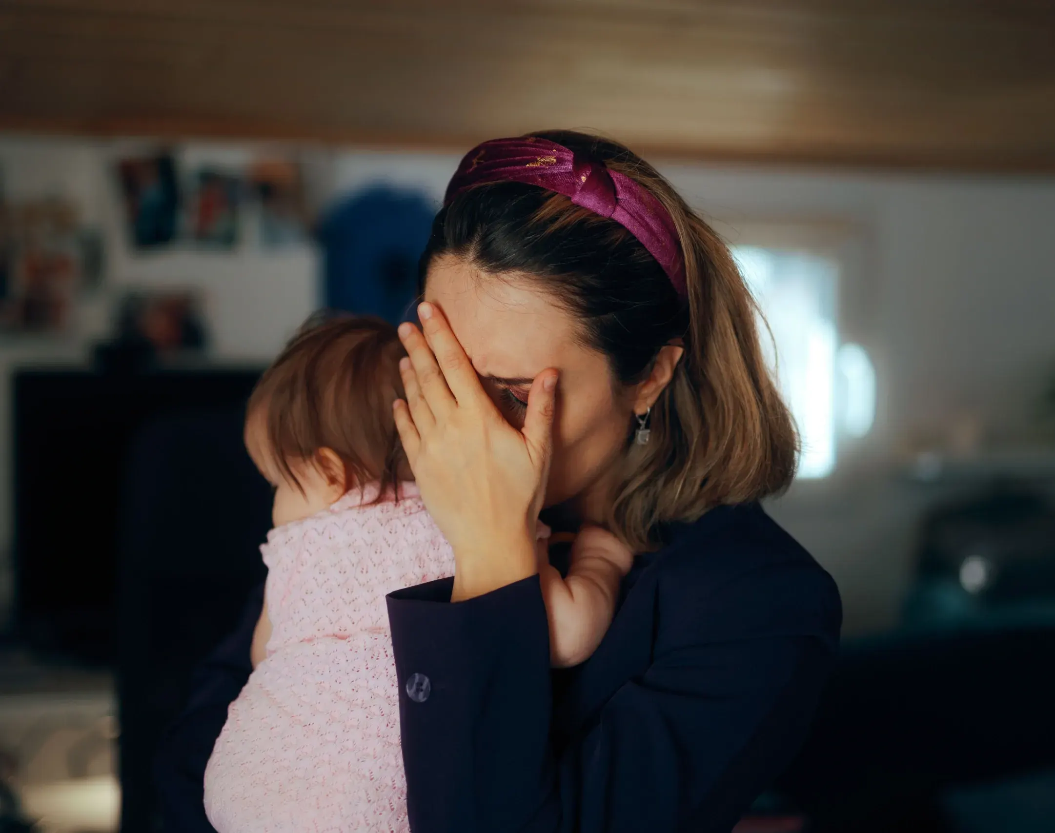Mother and healthcare provider discussing postpartum depression symptoms and treatment options