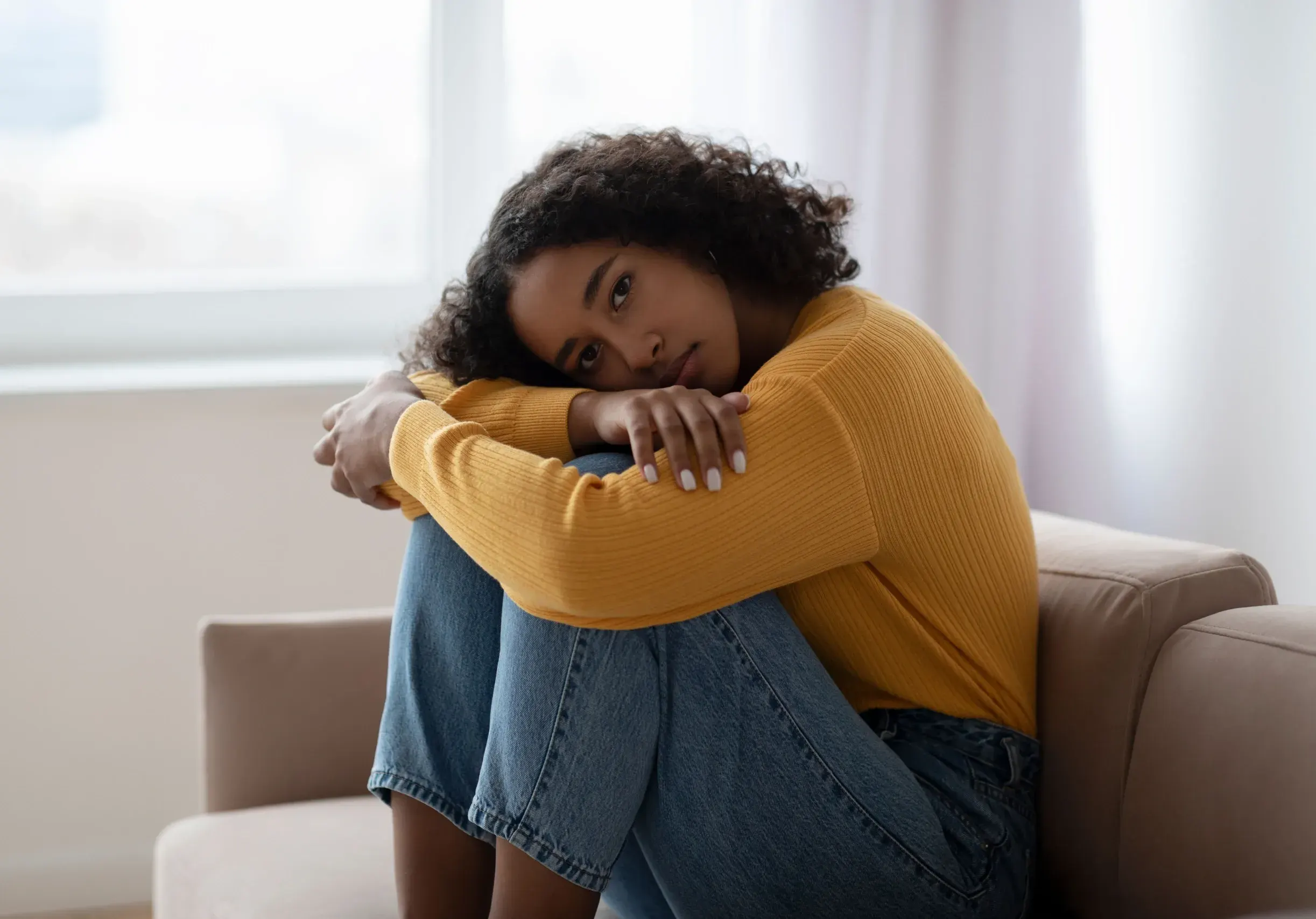 New mother recognizing postpartum depression symptoms and seeking help